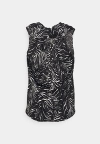 Blouse noire sans manches avec des rayures blanches en zèbre et un col froncé, agrémentée d'un grand nœud en tissu.