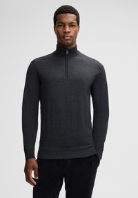 Dunkelgrauer Langarm-Pullover mit hohem Kragen und halbem Reißverschluss. Verfügt über einen strukturierten Stoff und einen geraden Saum.
