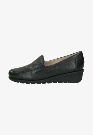 Black leather slip-on shoe with a textured surface, rounded toe, and a low wedge sole. Features minimal stitching and a padded interior.