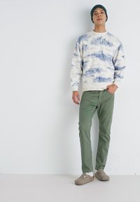 Levi's® 502™ TAPER - Traperice suženog kroja - four leaf clover