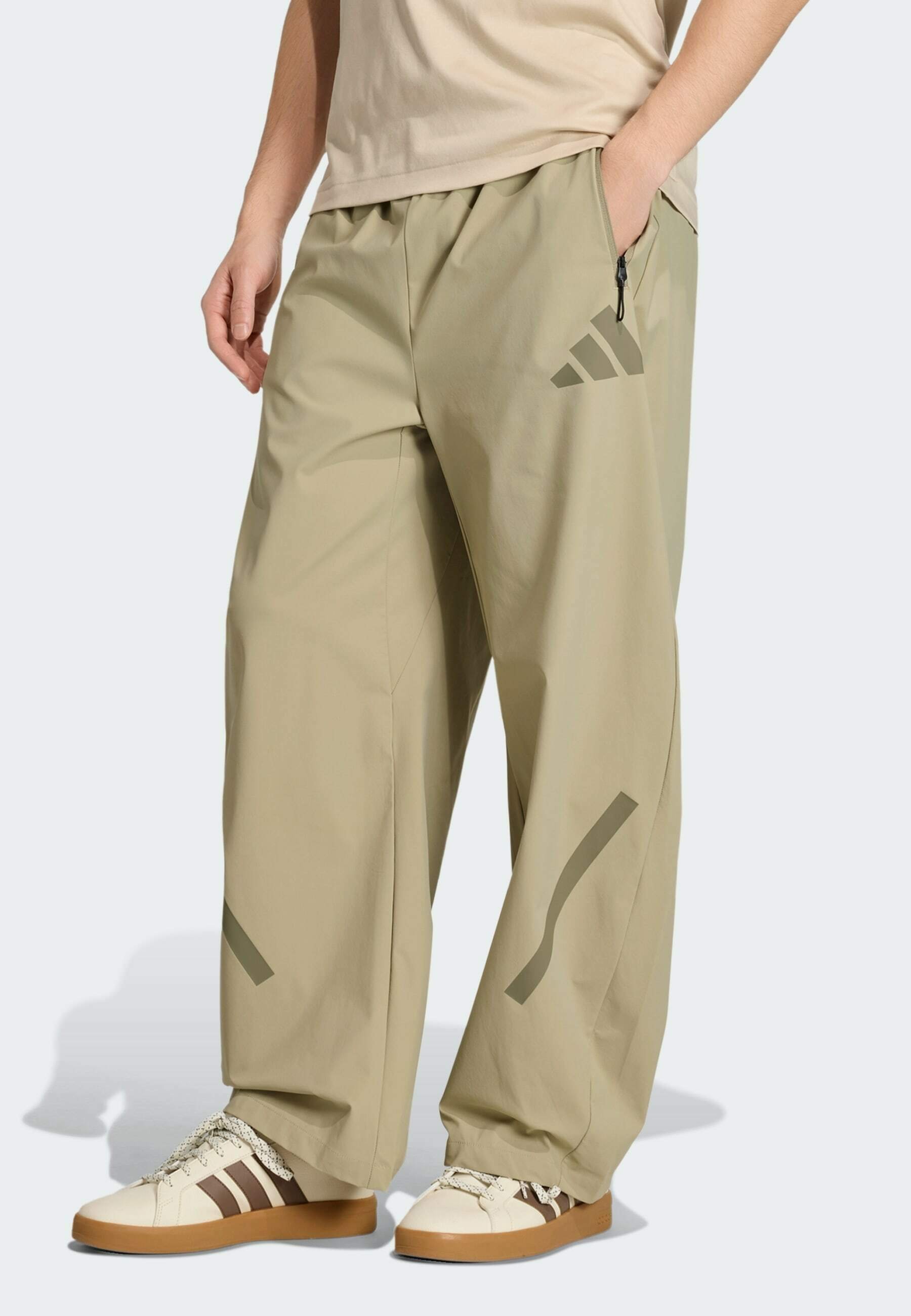 adidas Sportswear ADIDAS Z.N.E. WOVEN - Tracksuit bottoms - beige