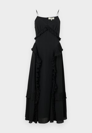 Vestido maxi negro con tirantes finos, que presenta un borde con volantes por los bordes y cortes laterales, hecho de una tela ligera. Silueta acampanada.
