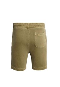 Pantaloncini verde oliva in cotone. Caratterizzati da una cintura elastica, lunghezza corta e una singola tasca posteriore con patta arrotondata.