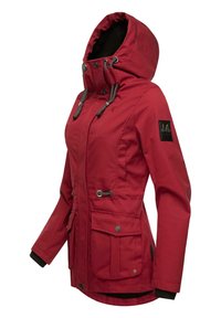 Red outdoor jacket with a hood, two front pockets, and gray drawstrings. Features black cuffs and a branded patch on the sleeve.