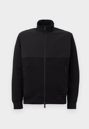 Black full-zip jacket with high collar, two zippered side pockets, and ribbed cuffs, laid flat on a white background.