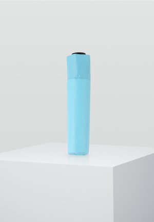 Light blue umbrella, cylindrical shape, polyester fabric, compact design with a black handle at the top. Smooth texture, no visible patterns.