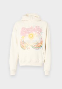 Cream hoodie featuring a colorful graphic with a sun, waves, and floral accents. Made of soft material with a drawstring hood and ribbed cuffs.