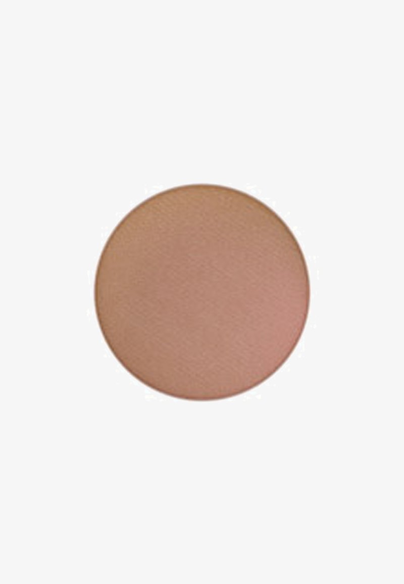 Ronde blush compact in een zachte perzikkleur, matte afwerking met een gestructureerd oppervlak. Compacte vorm, gladde randen, geen zichtbare hardware of accenten.