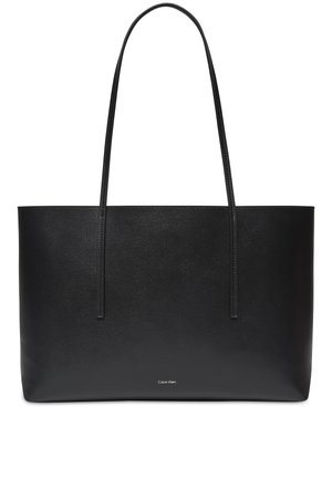 Sac cabas en cuir noir avec des bretelles fines et un petit logo Calvin Klein centré près du bas.