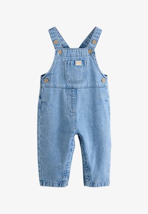 Šviesiai mėlynos džinsinės kūdikių petnešos su reguliuojamomis sagomis ir priekyje esanti kišenėlė su mažo šypsančio veido žyme.