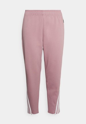 Roze taps toelopende sweatbroek met elastische tailleband en witte zijstrepen die eindigen in kleine ritsjes bij de enkels.