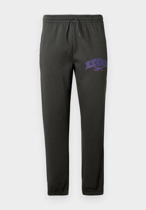Black jogger pants made from soft fabric, featuring an elastic waistband with drawstring and a purple "Reebok" logo on the left thigh.
