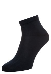Calza nera alla caviglia con bordo a costine, realizzata in un materiale liscio e elastico, dotata di una punta senza cuciture e di una forma aderente.