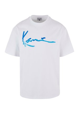 White cotton t-shirt featuring a blue abstract design across the chest. Short sleeves and a round neckline complete the casual look.