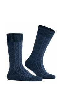 Calze in maglia blu navy con un motivo testurizzato e un bordo a coste, caratterizzate da un'ottima miscela di materiali per comfort e calore.