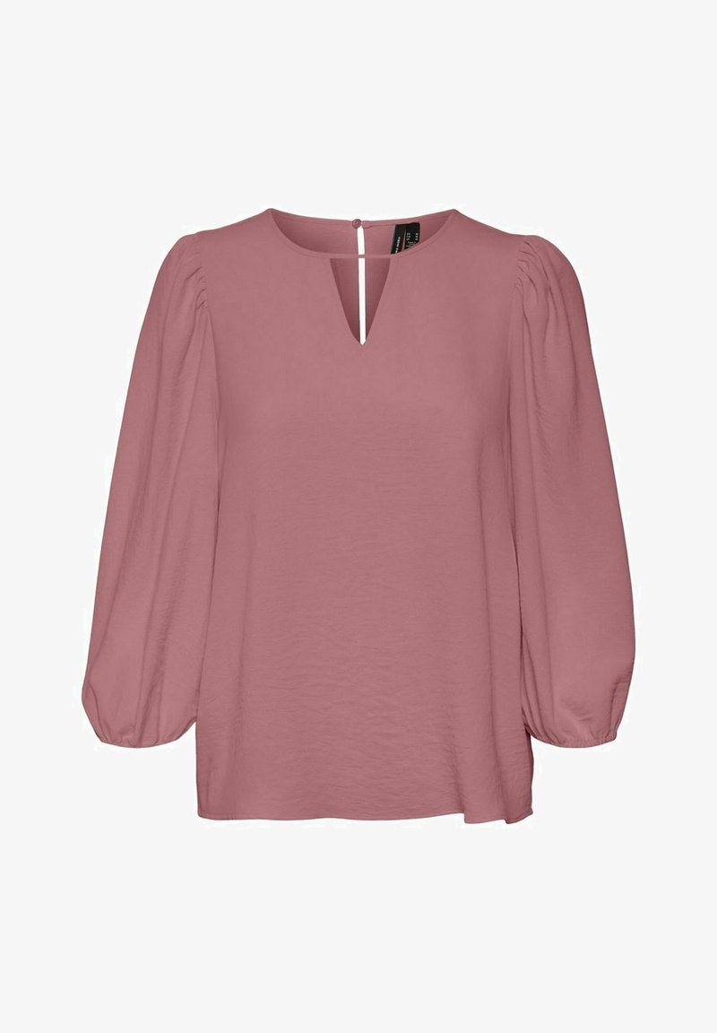 Blouse mauve à manches longues bouffantes, décolleté rond, avec un détail d'ouverture en forme de V à l'avant et une petite fermeture par bouton à l'arrière.