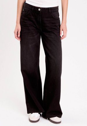 Jean large - denim noir