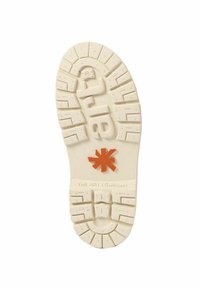 Suela de zapato de goma blanca con patrones de textura, que presenta un detalle central en forma de estrella naranja. El nombre de la marca está impreso y es visible.