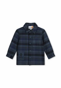Camicia flanella a quadri in navy e nero, con chiusura a bottoni frontale, colletto e patch logo sul lato sinistro del petto. Maniche lunghe e vestibilità standard.