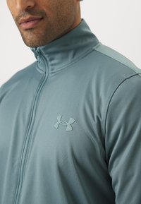 Under Armour RIVAL KNIT - Tracksuit - jasper blue/serpentine