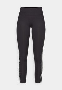 Svarte treningsleggings med høy midje, med en sidestripesdesign i hvitt med merketekst. Glatt, elastisk stoff.