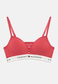 Κόκκινο bralette Tommy Hilfiger με ρυθμιζόμενους ιμάντες και λευκή ελαστική ζώνη που φέρει το όνομα και το λογότυπο της μάρκας.