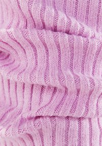 Light pink knit fabric with vertical ribbing texture. Soft, fuzzy material with a lightweight composition and subtle sheen.