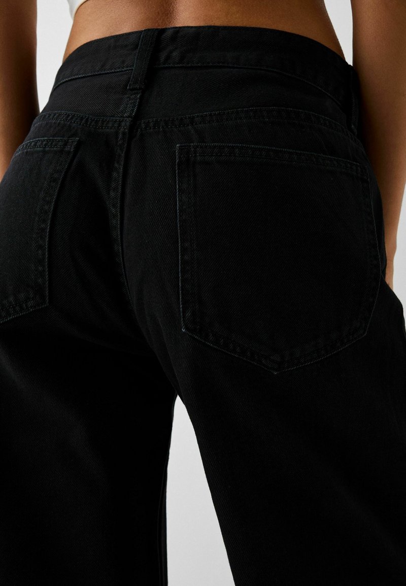 Bershka Jeans a zampa black/nero (Second hand)