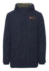 Navy blue insulated jacket featuring a hood, zip closure, two front pockets, and an orange brand patch on the left side.