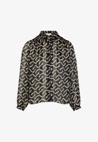 Blusa de patrón negro y beige con botones en la parte delantera, textura suave, manga larga y un corte relajado, con un diseño abstracto.