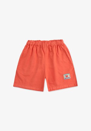 Coral cotton shorts with an elastic waistband and side pockets. Features a patch with "Joy" logo on the lower right side.