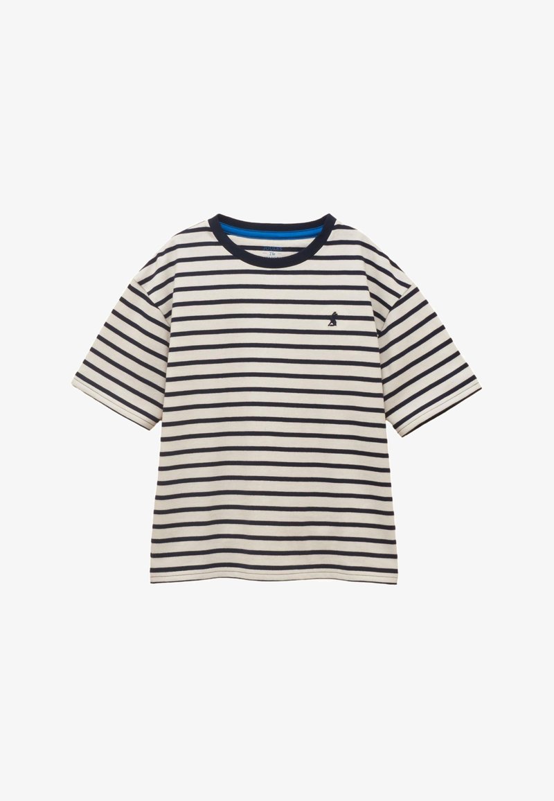 Chemise à manches courtes crème avec des rayures horizontales noires, col rond bleu marine, et petit oiseau noir brodé sur la poitrine gauche.
