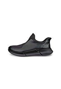 Încălțăminte sport neagră cu un design elegant și fără cusături. Fabricată din material sintetic neted, având o talpă îmblănită și o formă low-profile.