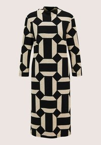 Langarm-Midisakko mit hohem Kragen, das ein auffälliges geometrisches Muster in Beige und Schwarz aus Rechtecken und schrägen Formen zeigt.