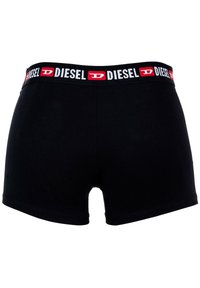 Schwarze Boxershorts aus weicher, dehnbarer Baumwolle mit einem elastischen Bündchen in Rot und Weiß, das das 'DIESEL'-Logo trägt.