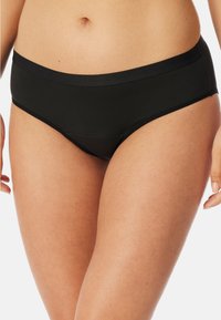 Braguita bikini negra con una cinturilla suave, tejido elástico y un corte clásico con costuras a lo largo de los bordes para mayor comodidad.