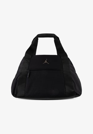 Μαύρη σακούλα νάιλον, με φερμουάρ, εμφανές λογότυπο Jumpman και ανθεκτικές υφασμένες λαβές. Απαλή υφή συνολικά.