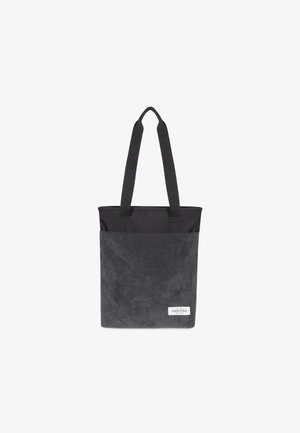 Sac fourre-tout noir en toile avec une texture côtelée verticale, poignées supérieures et une étiquette logo Eastpak blanche à l'avant. Forme rectangulaire.