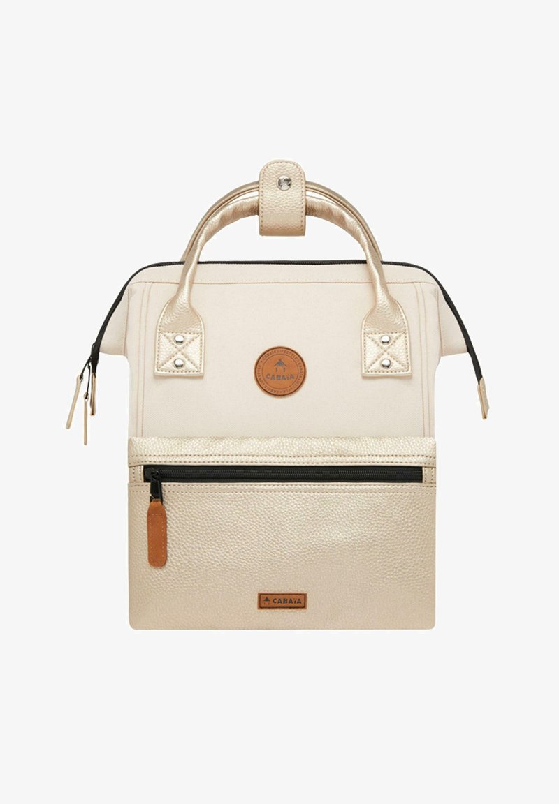Beige handbag with a textured material, dual handles, a zip top, and a front pocket. Features a circular logo and brown leather accents.