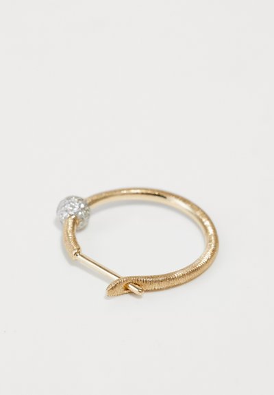 Gold hoop earring with a textured finish, featuring a silver sparkly ball accent. Circular design with a pin closure mechanism.