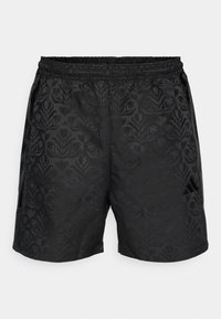 Black shorts with a textured floral pattern, elastic waistband, side pockets, and a small logo on the lower right side.