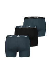 Drei Paar Boxershorts mit einem schwarzen Design und einem türkisfarbenen Design, jeweils mit einem kontrastierenden weißen Markenbund. Aus Baumwollmaterial.