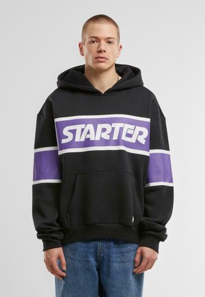 Black hoodie with purple and white horizontal stripes. Features a large "STARTER" logo, a front pocket, and a drawstring hood.