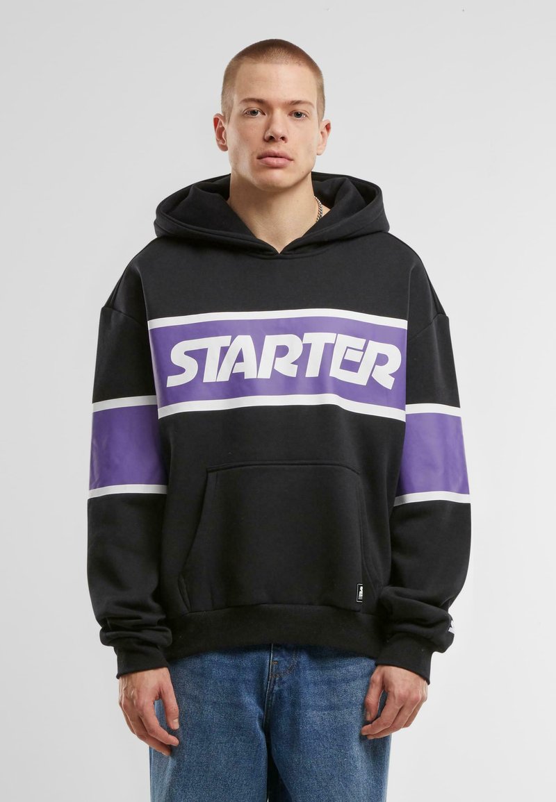 Black hoodie with purple and white horizontal stripes. Features a large "STARTER" logo, a front pocket, and a drawstring hood.