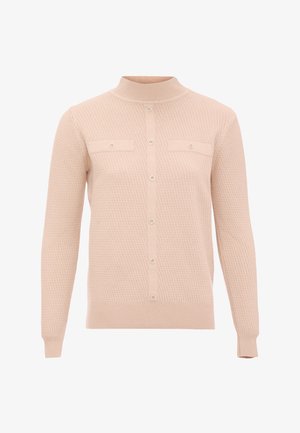 Meruňkový pletený kardigan s vysokým límcem, předním zapínáním na knoflíky a dvěma náprsními kapsami. Má texturovanou tkaninu a pružné manžety.