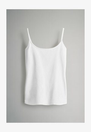 Bela brezrokavnica z tankimi naramnicami, izdelana iz gladkega, lahkotnega materiala. Ima okroglo izrezan ovratnik in raven rob.