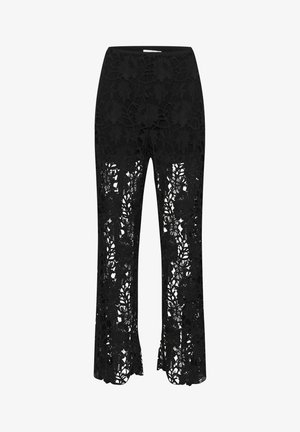 Mustrilised mustad pitsad lillemustriga, laieneva hemiga ja läbipaistva alumise osaga. Pehme tekstuur ja elastne vöökoht tagavad mugavuse ja stiili.