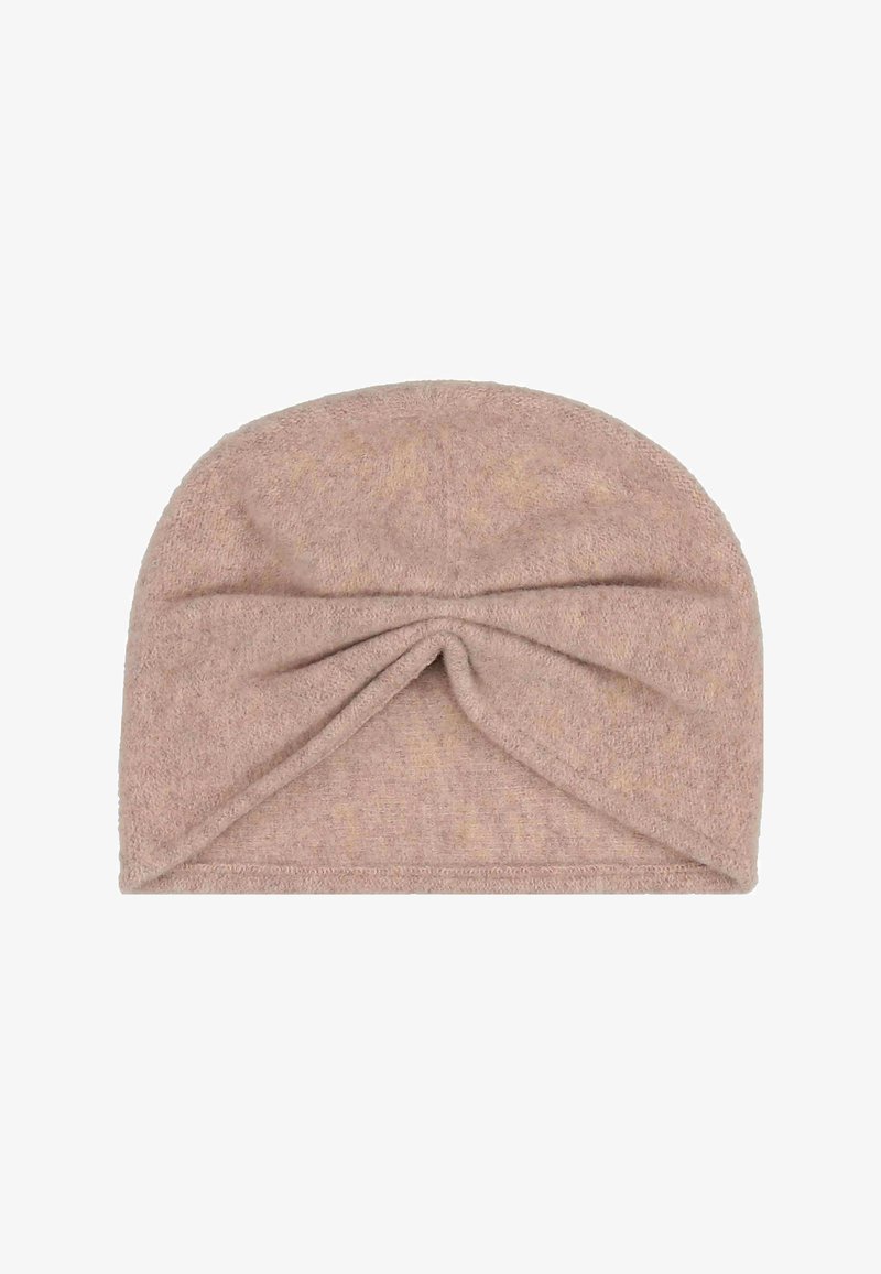 Měkký béžový turbanový headband z froté tkaniny se zkrouceným uzlem vpředu.