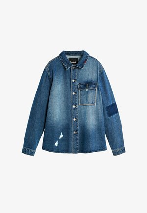 Denim button-up jacket with chest pocket, faded wash, distress marks on front, and patch detail on right sleeve.