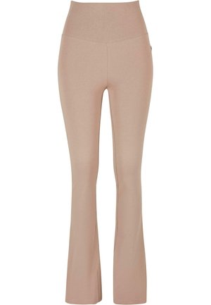 Leggings beige a zampa d'elefante con vita alta, realizzati in tessuto elasticizzato, caratterizzati da una texture liscia e dettagli di cucitura minimi.